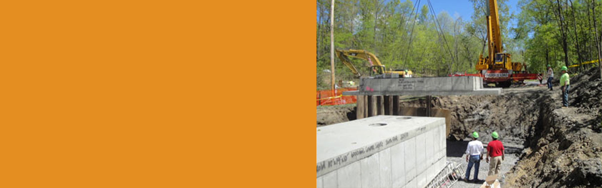 Slider background of two men observing tractor lifting object